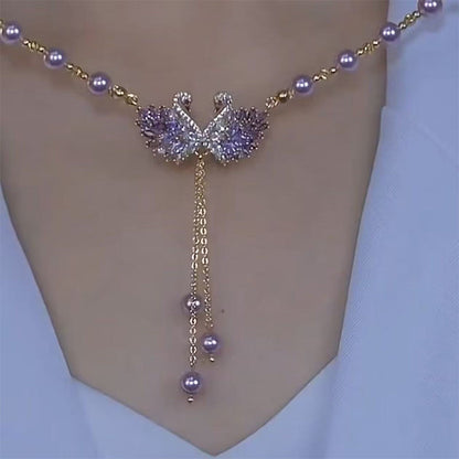 💎 LIMITED-TIME 50% OFF! 🦢 Double Swan Heart Pendant Necklace – Sparkling Purple Stones & Pearls 🔮