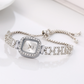 ⌚ LIMITED-TIME 50% OFF! ✨ Women's Drawstring Bracelet Watch – Square Face, Crystal Accents, Quartz Movement 💎