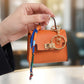 👛 2026 Sale — Over 48,000 Sold!✨ Mini Keychain Coin Purse – Gold-Tone Clasp & Ribbon Detail 🎀