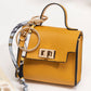 👛 2026 Sale — Over 48,000 Sold!✨ Mini Keychain Coin Purse – Gold-Tone Clasp & Ribbon Detail 🎀